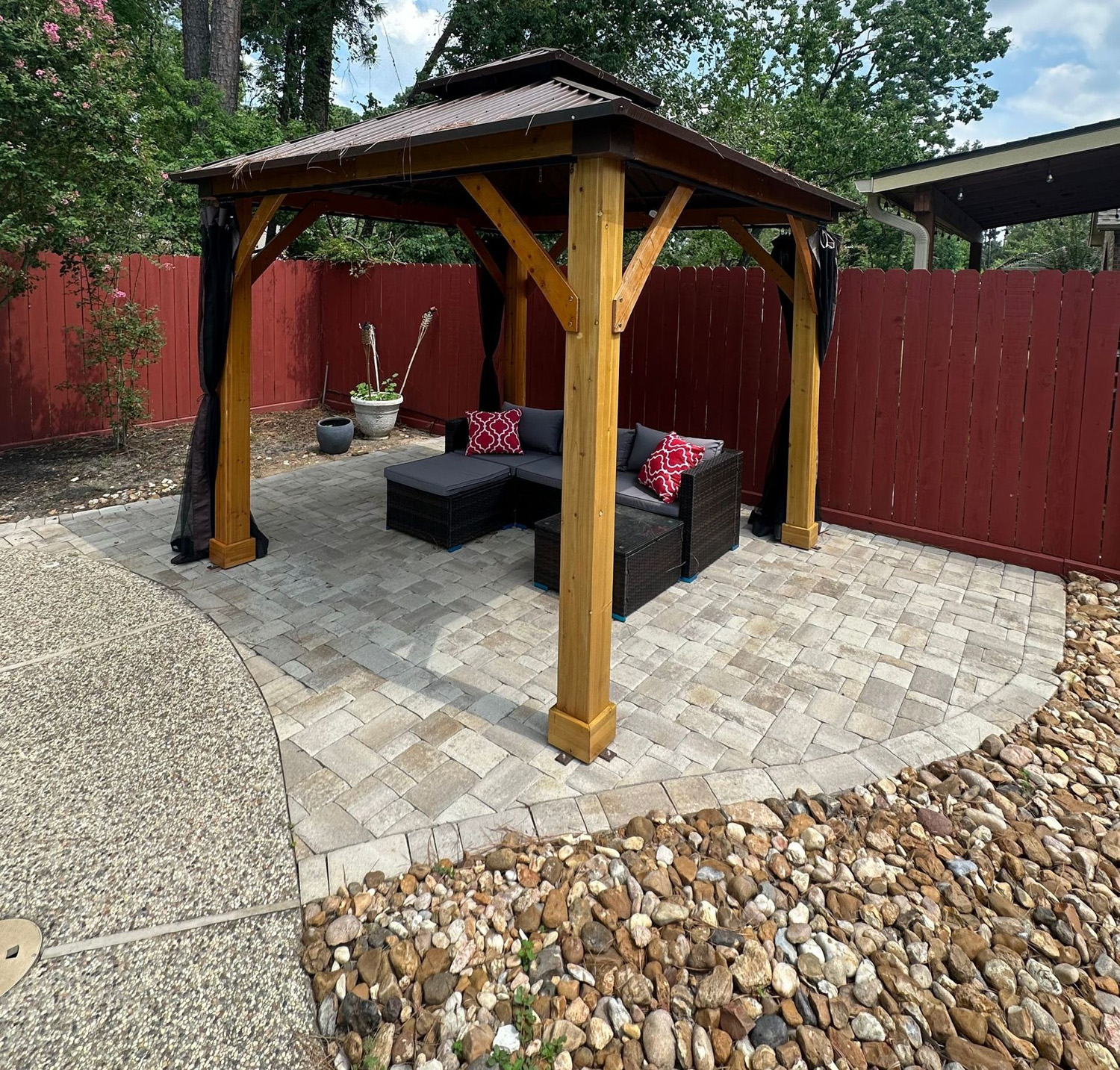 Paver pad installation supporting a timber gazebo with decorative gravel transitions