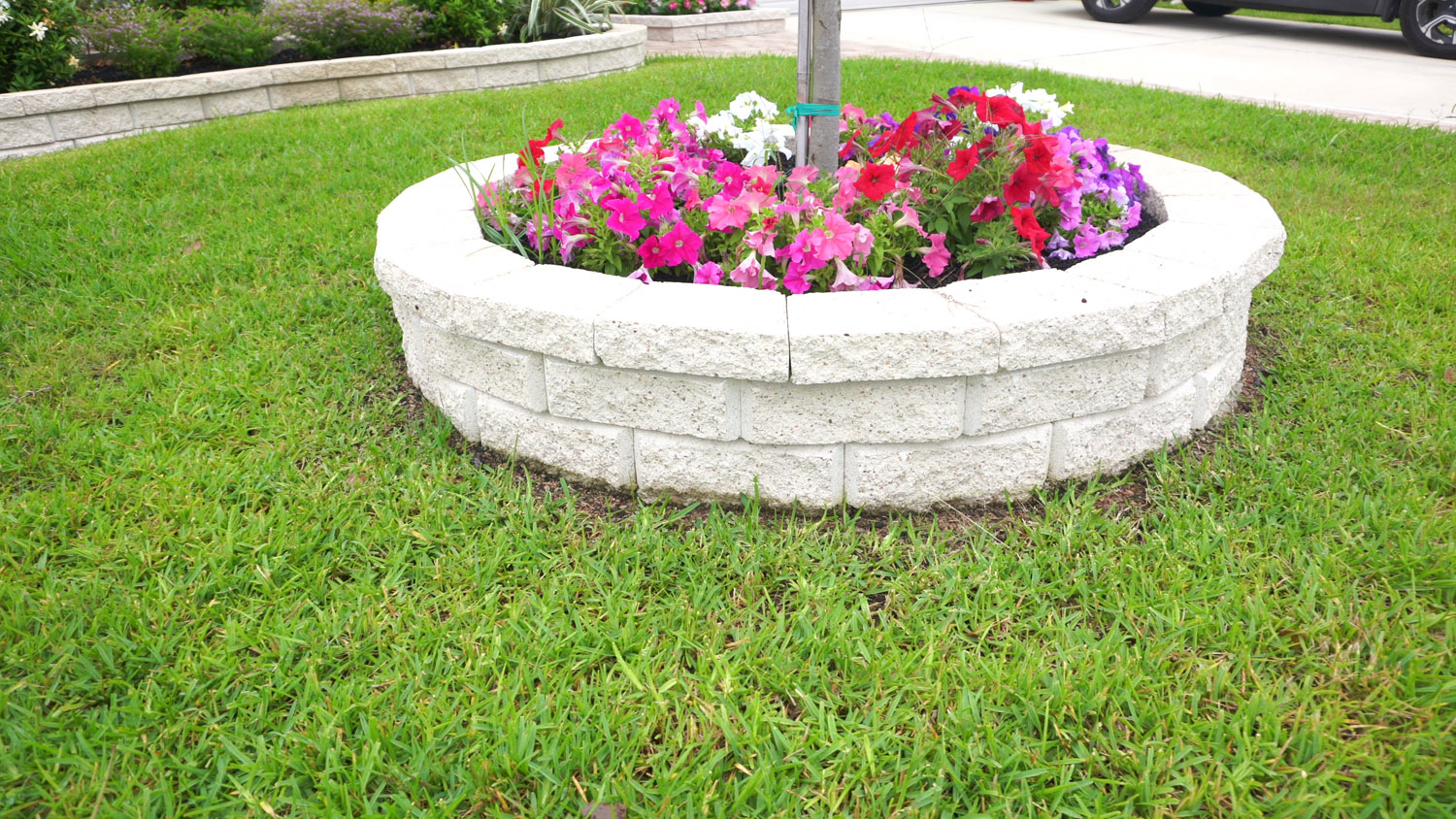 bezuz-landscaping-and-design-circular-stone-flower-planter