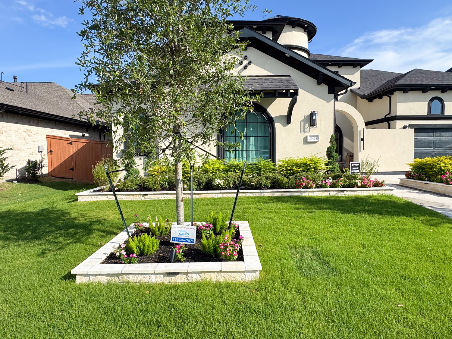 bezuz-landscaping-and-design-front-lawn-stone-tree-planter