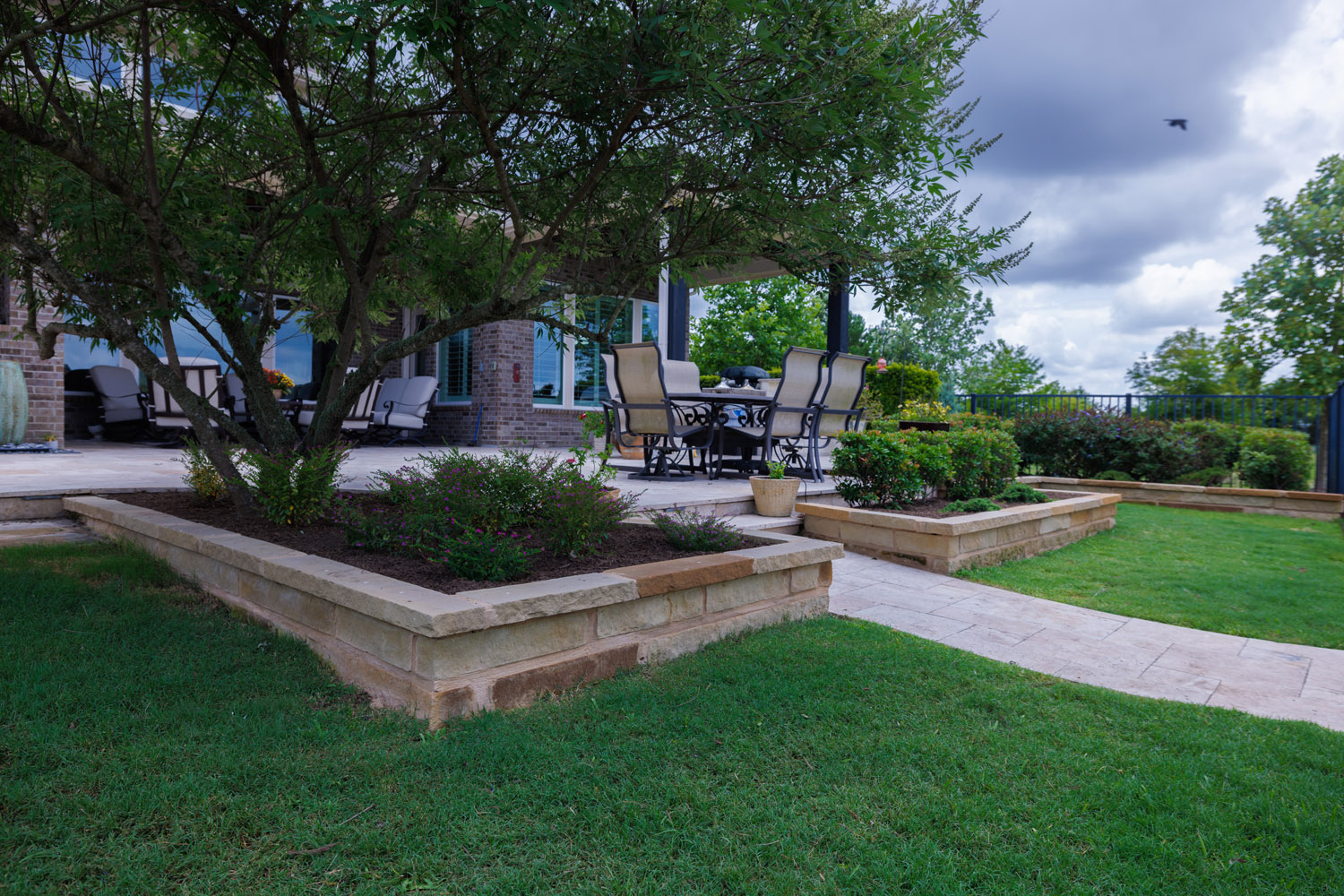 bezuz-landscaping-and-design-tiered-stone-garden-beds-walkway