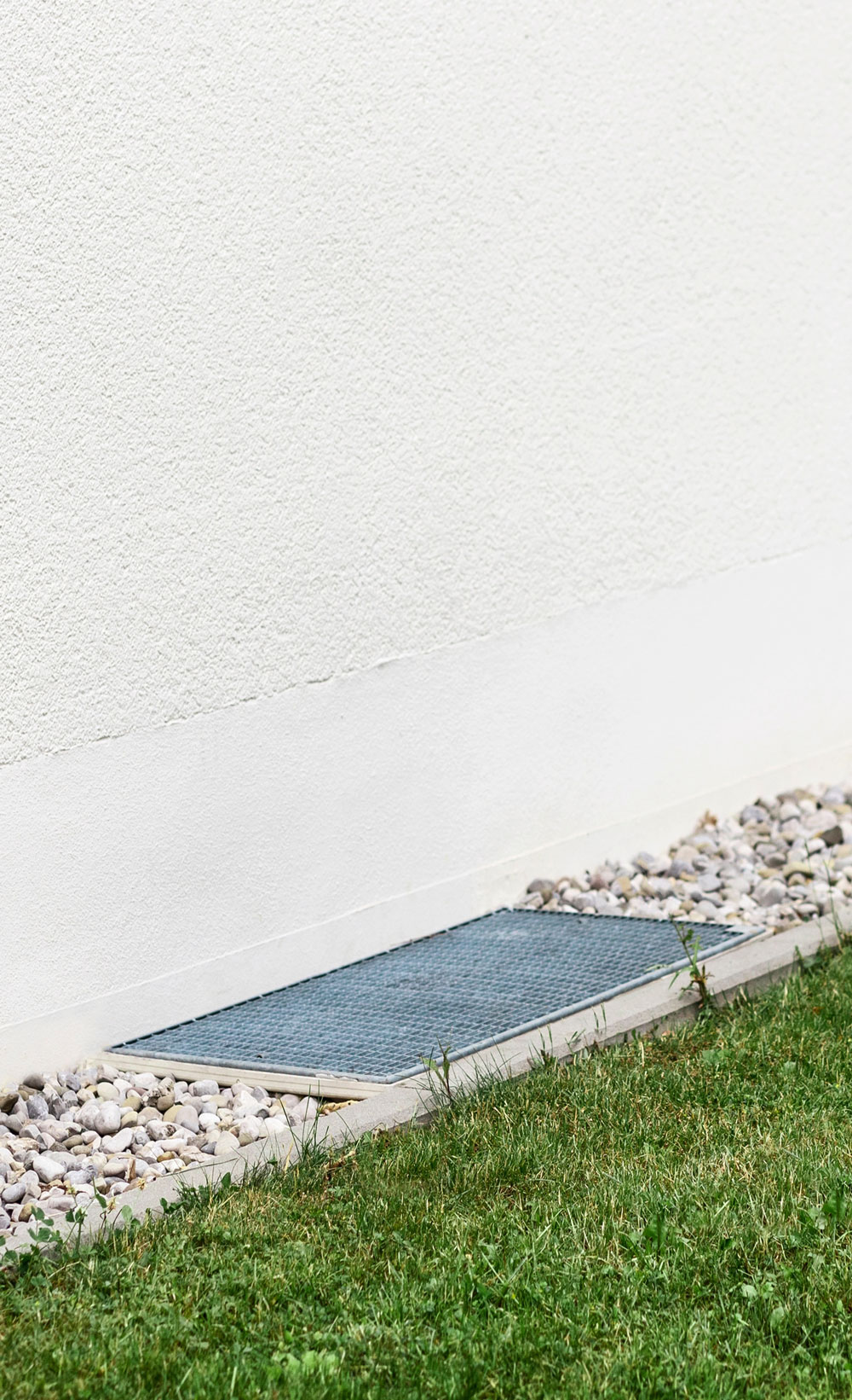 man playing soccer on backyard turf