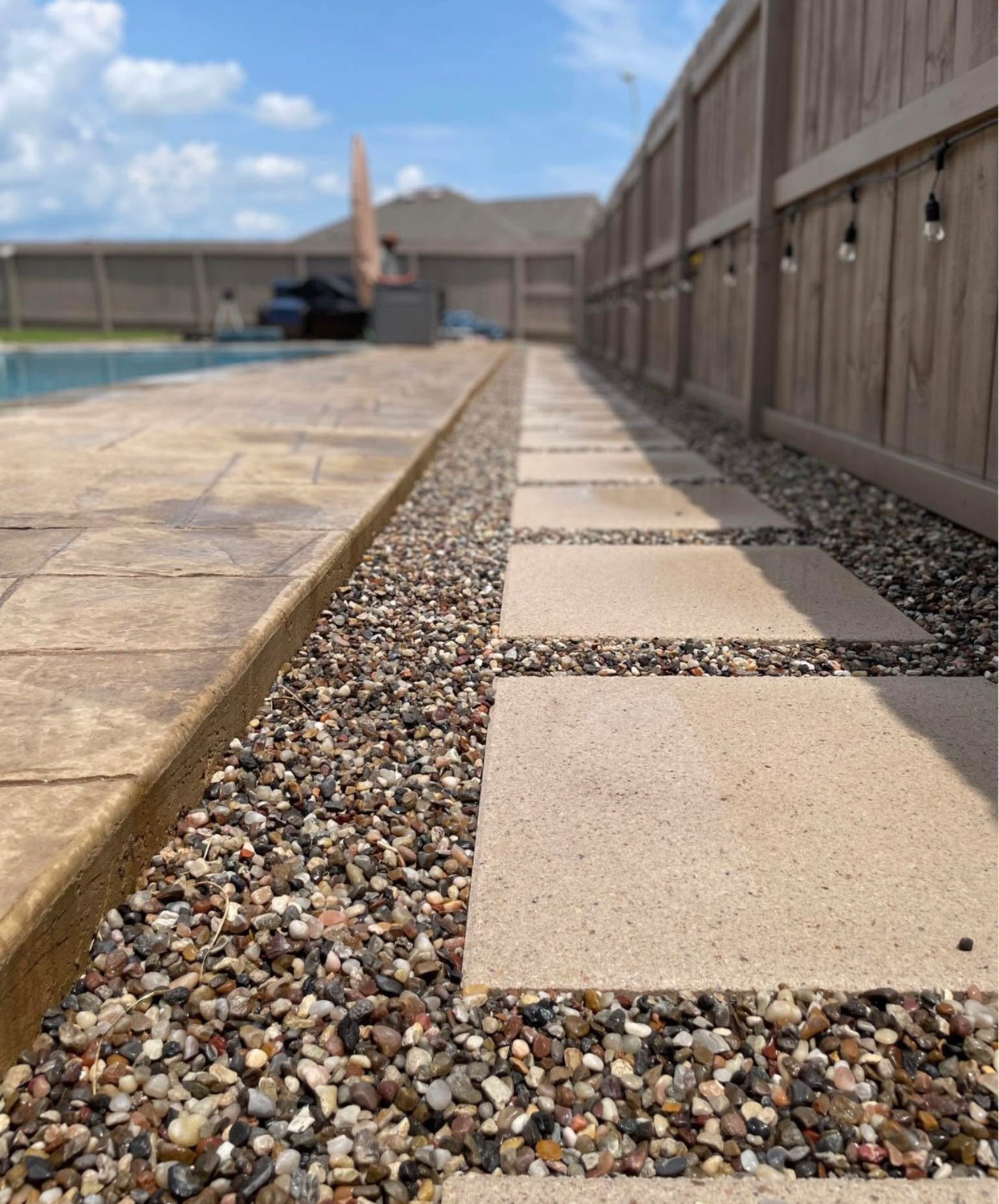 Bezuz-Landscaping-and-Design-commercial-poolside-paver-walkway-gravel